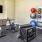 a room with a tv and exercise equipment