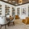 a room with a table chairs and a bookcase
