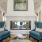 a lounge with a fireplace and seating