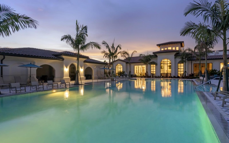 a pool with a building in the background
