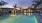 a pool with a building in the background