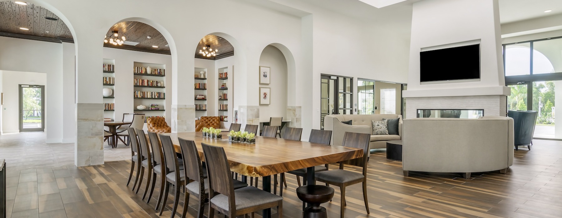 clubhouse with seating table and tv