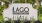 a sign outside with plants around it