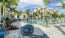 a pool with chairs around it