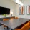 a room with a tv table and chairs